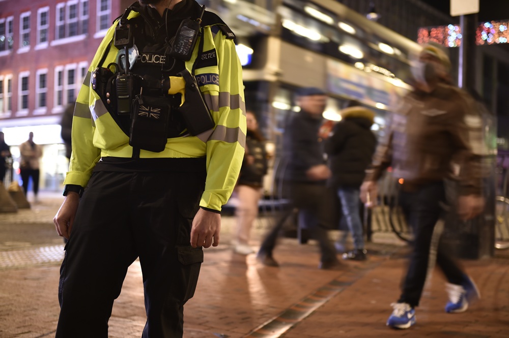 Police officer on patrol at night