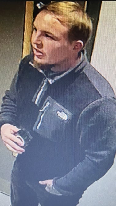 CCTV image of a man police want to trace following public order incident at Oxford retail park